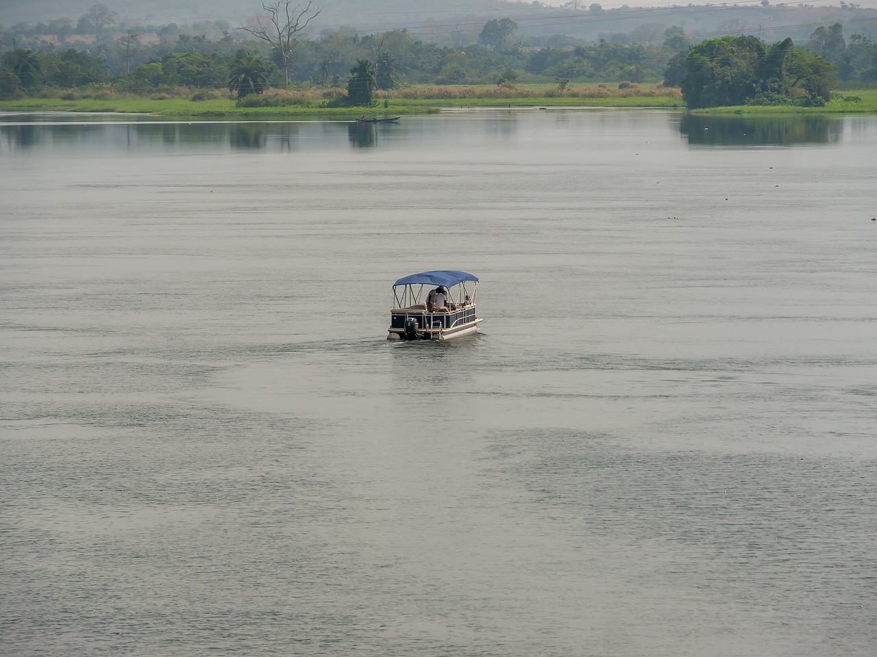 Small tour boat on the lower Volta near Atimpoku, Ghana 