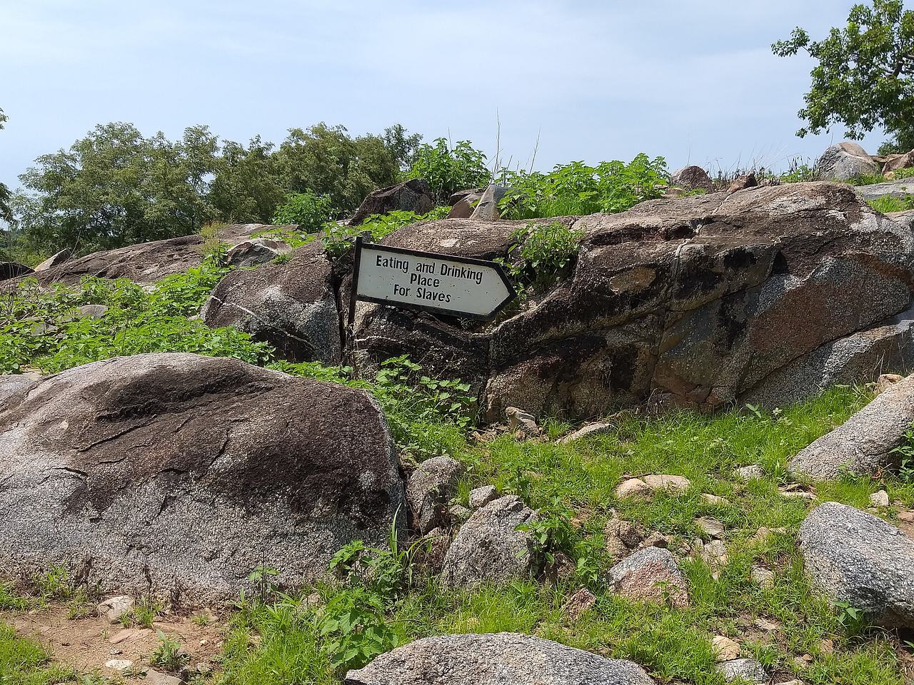 Sign post directing visitors to eating place of slaves.