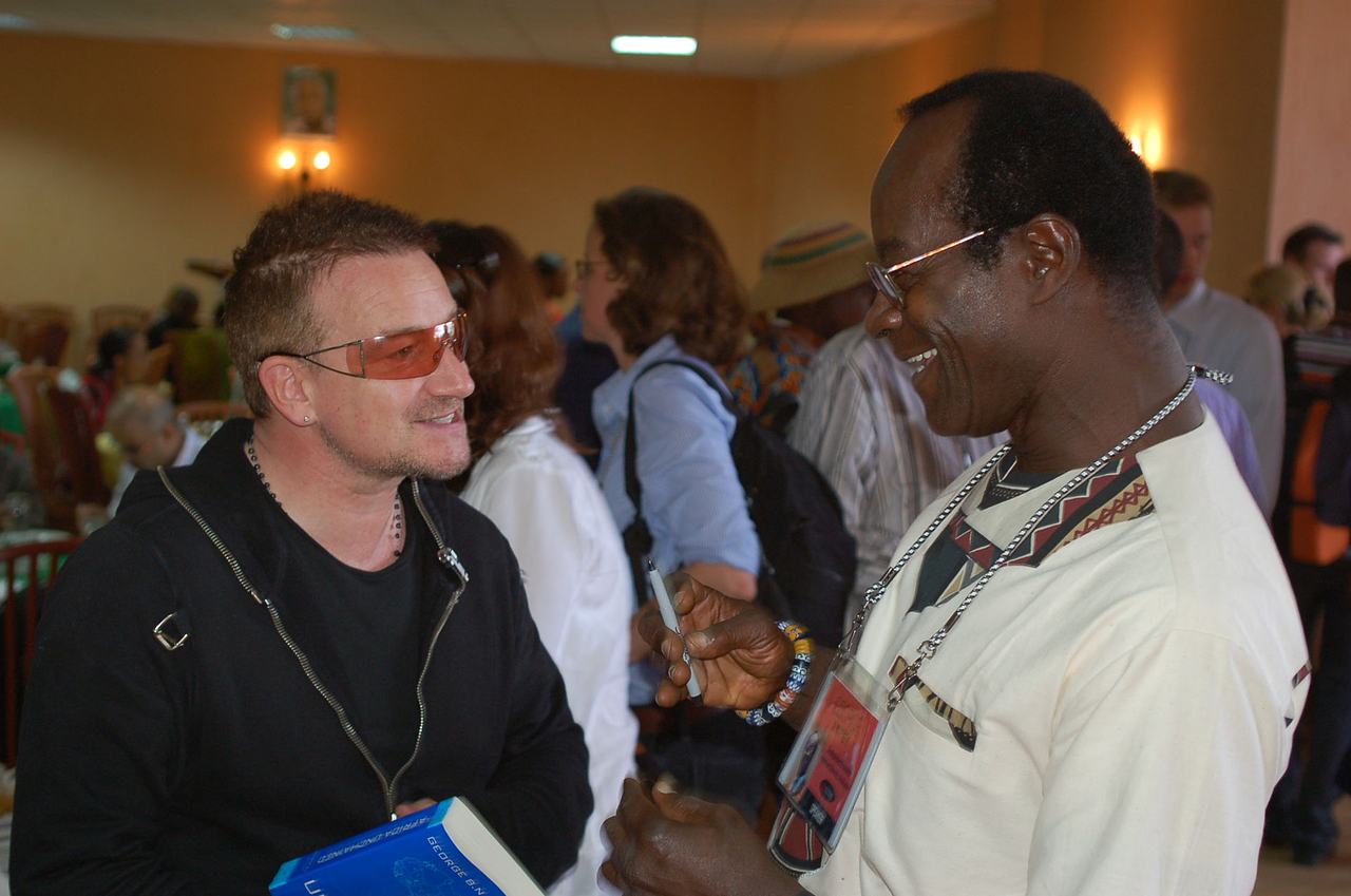 George Ayittey, economist from Ghana, talking with Bono at the TEDGlobal 2007 in Tanzania.