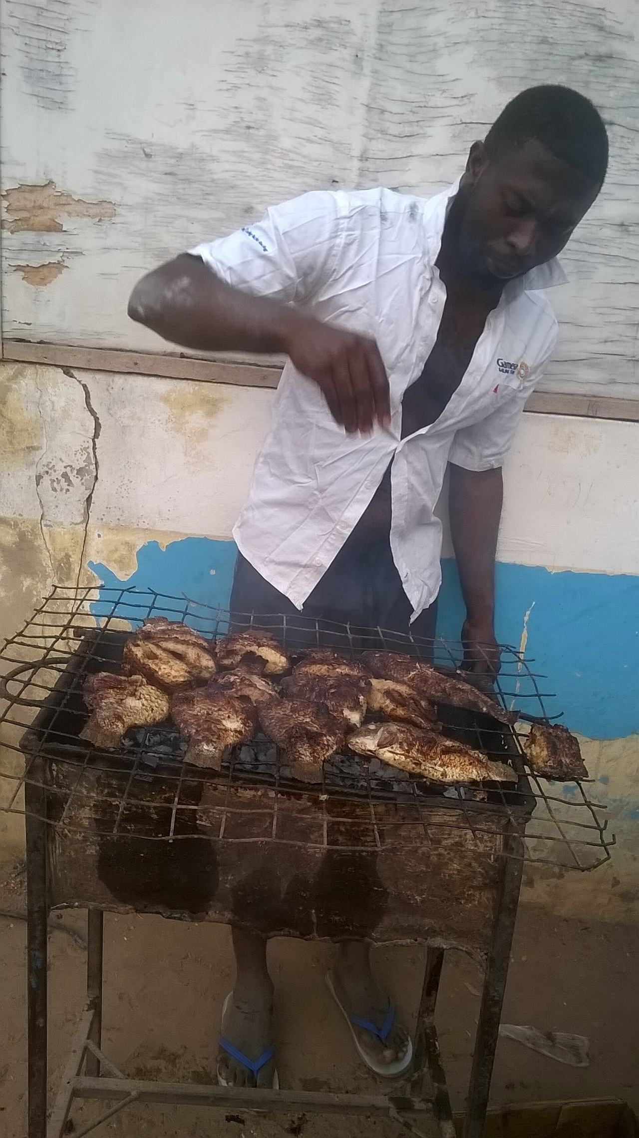 Grilling fish. The traditional way of grilling fish in Ghana.