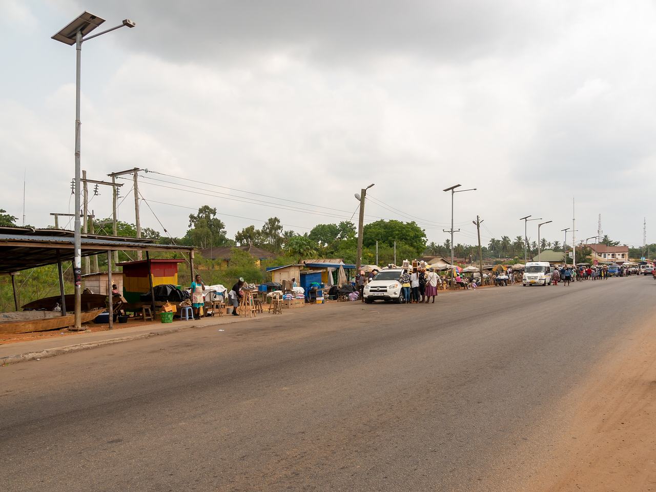 Street vendors hawking a vehicle on the road between Accra and Lomé (N1) near the Lower Volta Bridge 
