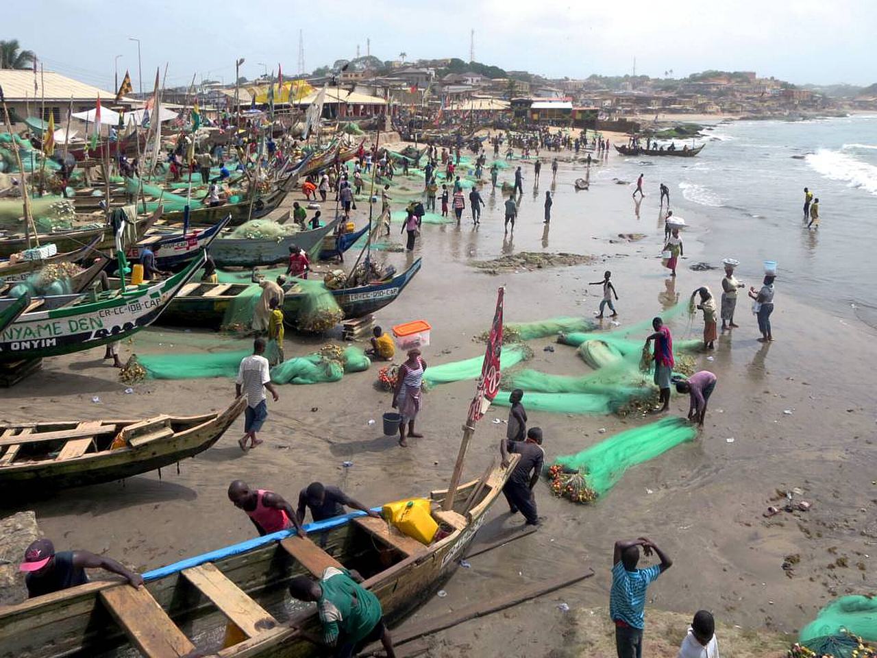 The beach at Cape Coast, Ghana, is always thronged by fisher folk.
