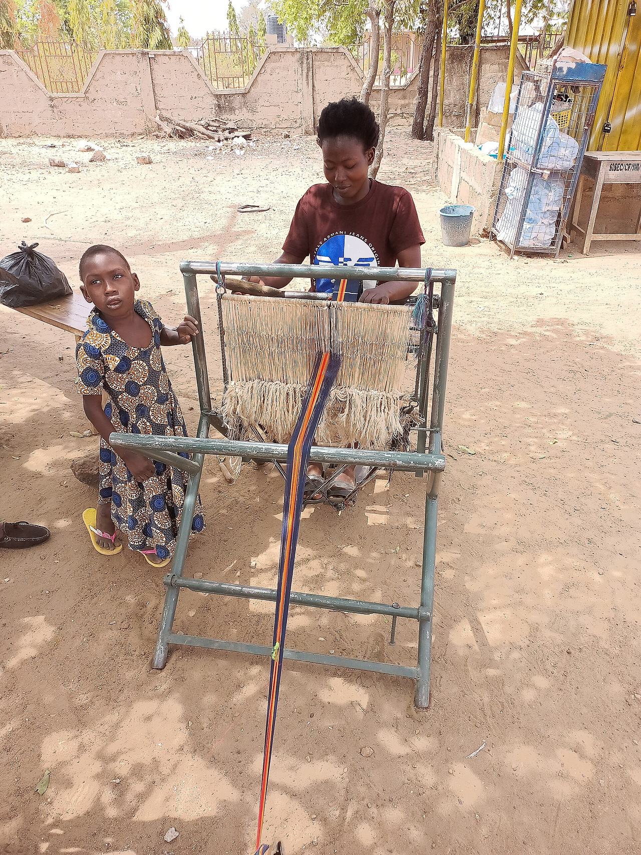 A woman Weaving the Kente cloth in Sirigu(upper east of Ghana)