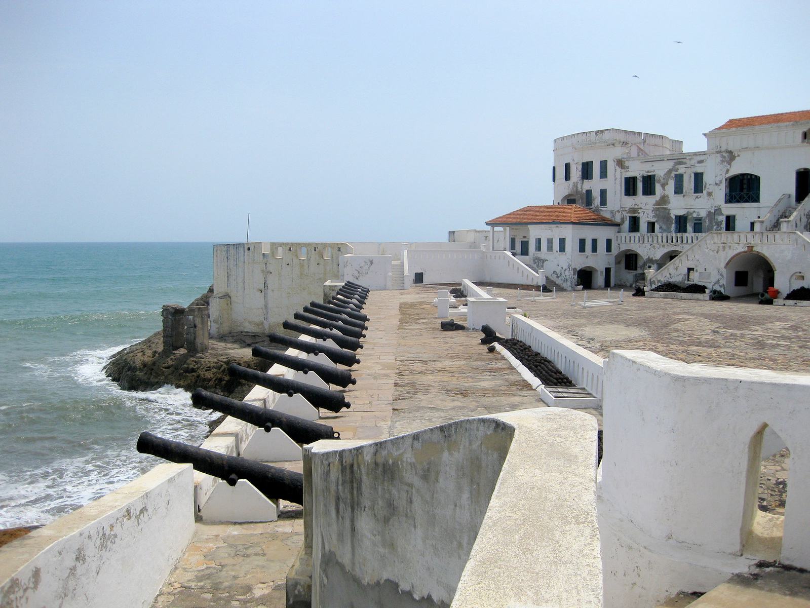 Cape Coast Castle courtyard and cannons overlooking the Atlantic