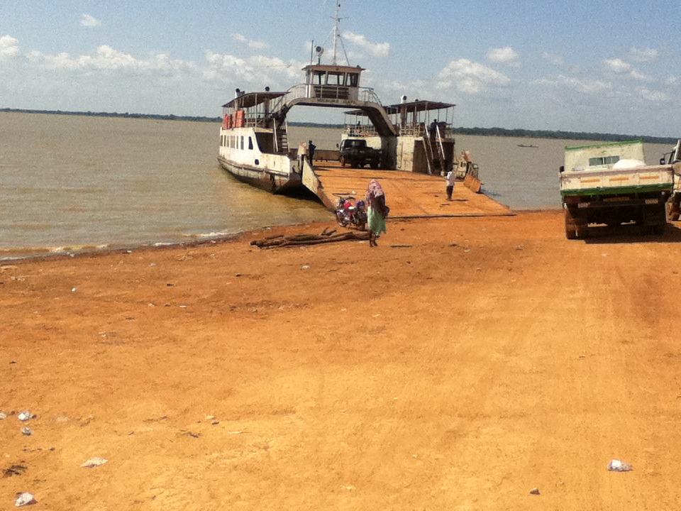 A ferry loading passengers on the Oti River in Ghana.