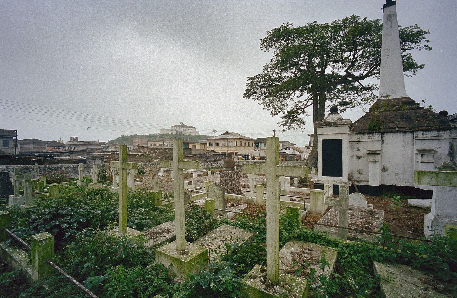 Rows of grave crosses and monuments at the Dutch Cemetery in Elmina, Ghana.