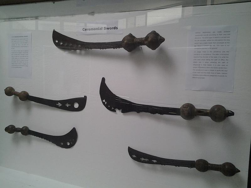 Display of pre-colonial royal machetes in a case at the National Museum of Ghana