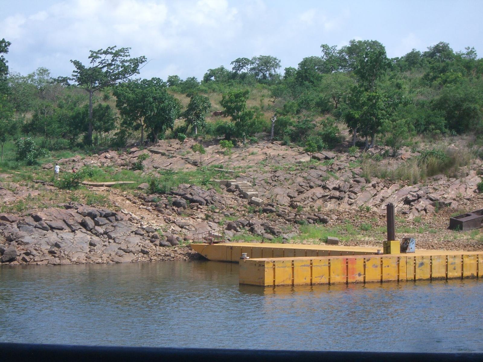 A wooden pier extending into Lake Volta at Dodi Island, Ghana
