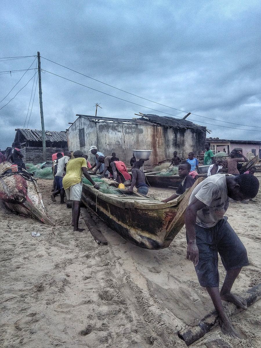Traditional fishing activity at Brenu Beach, Ghana.